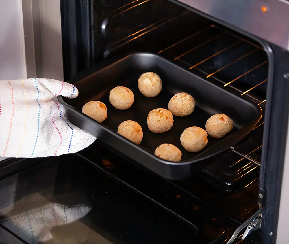 Preparación de pão de queijo